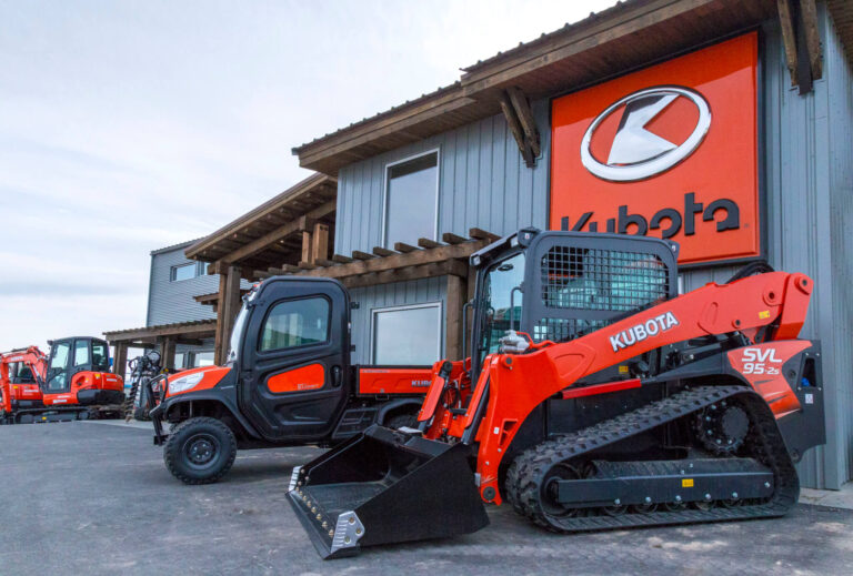 Kubota compact track loader parked outside Mountain West Rentals & Sales dealership.