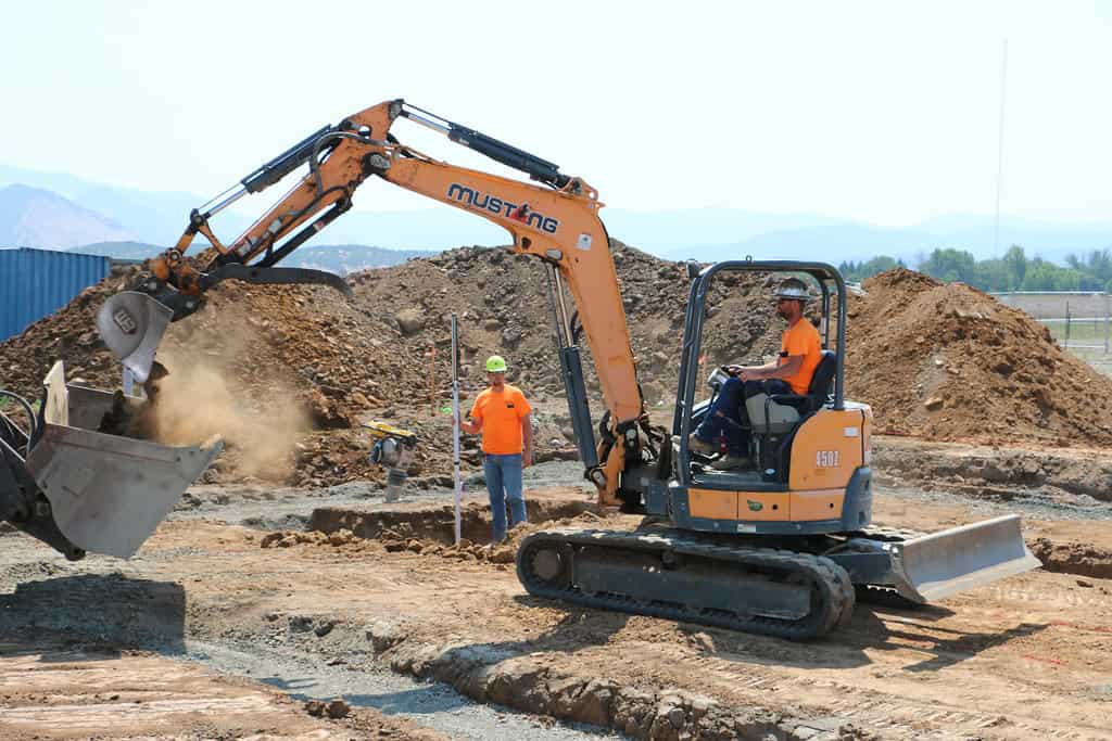 standard excavator - heavy equipment digging holes and building hot tubs in tight spaces